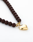 Bruine kralenketting met gouden stainless steel smiley