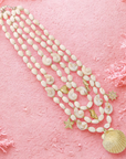 Gebroken witte kralenketting met beach bedels