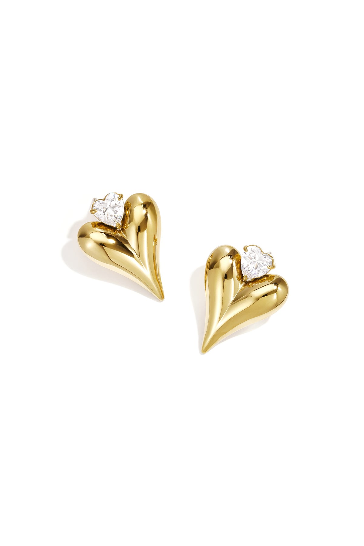 Goudkleurige stainless steel oorstekers met groot hart en hartvormig steentje