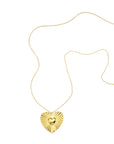 Goudkleurige lange stainless steel ketting met groot stralend hart en klein hartje in het midden