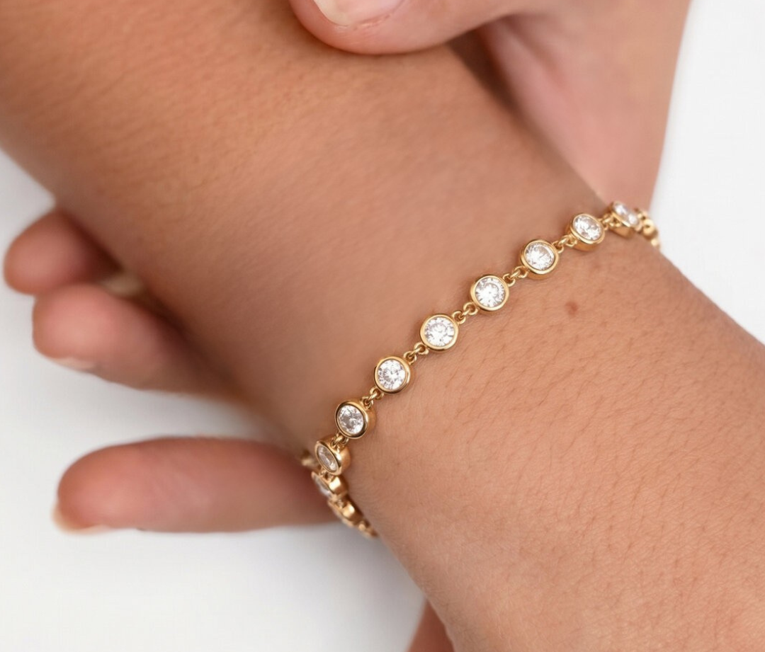 Gouden armband met ronde kristal steentjes